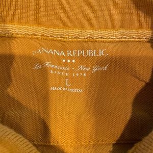 Banana Republic outlet  mens orange polo non smoking home excellent condition.